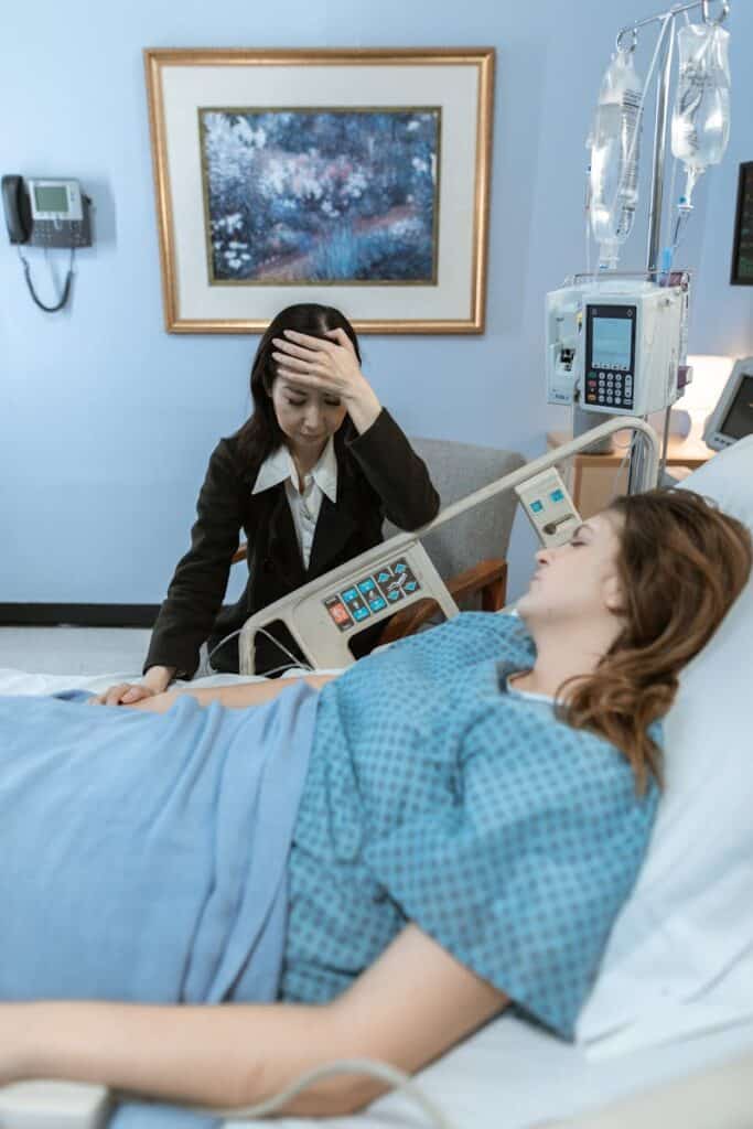 Worried Woman beside a Female Patient, advance medical directives